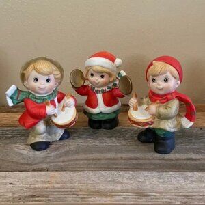 Three little boys playing music so sweet